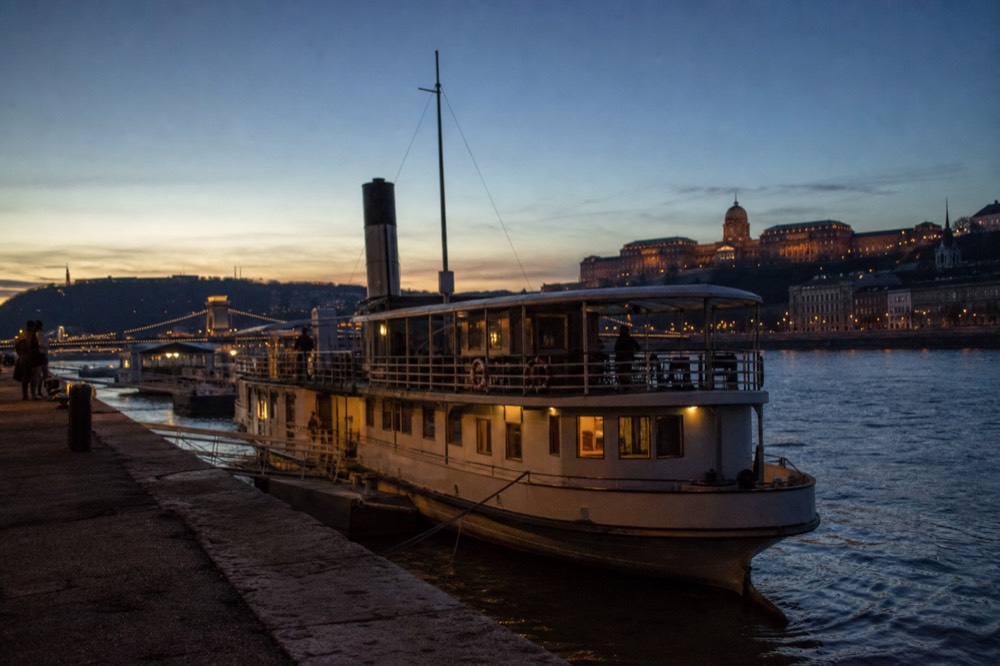 Historic paddle steamer boat moored on the Danube in Budapest at dusk, no text, no logos, no people